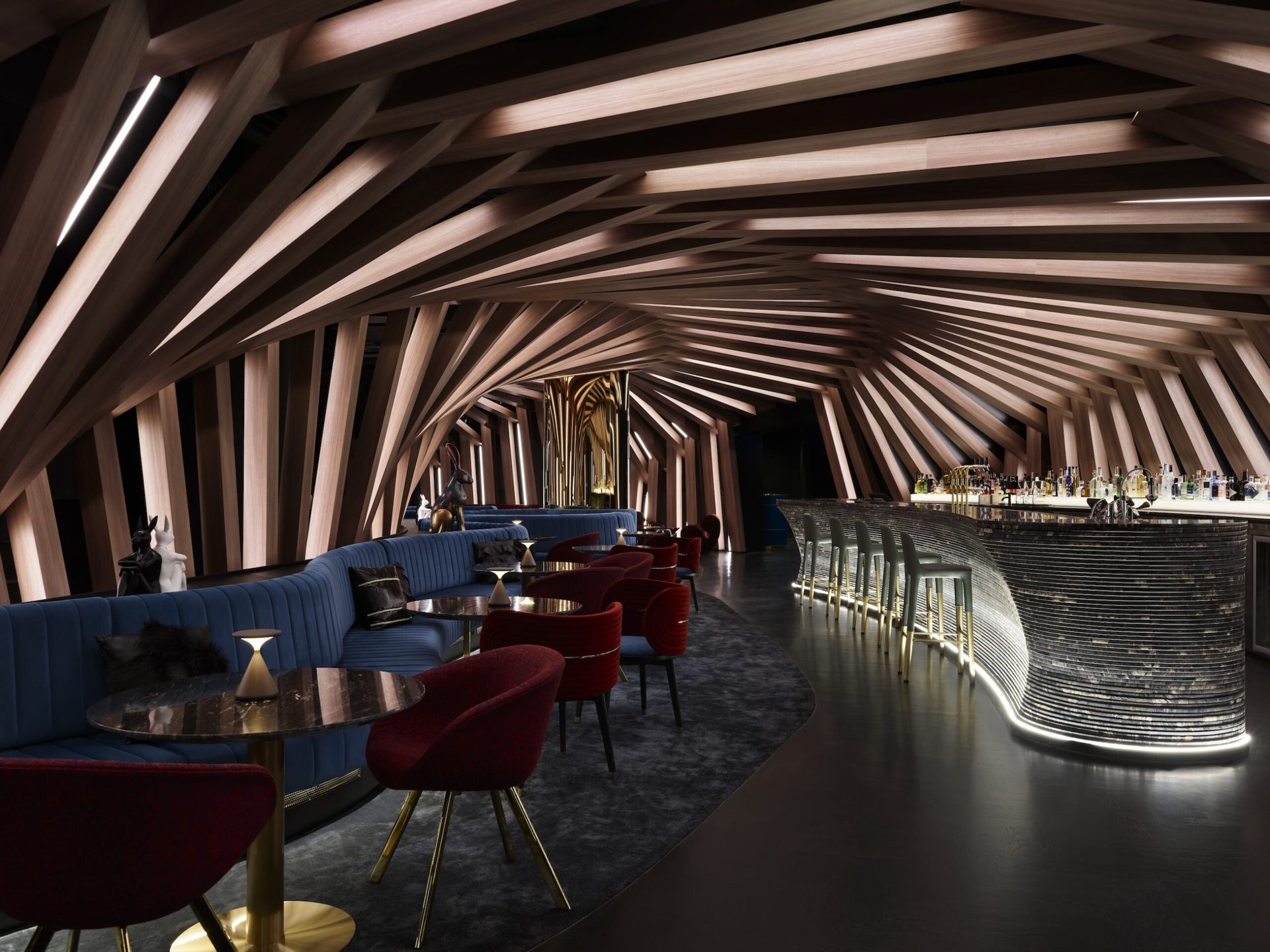 Cocktail lounge with sculpted timber ceiling and curved bar
